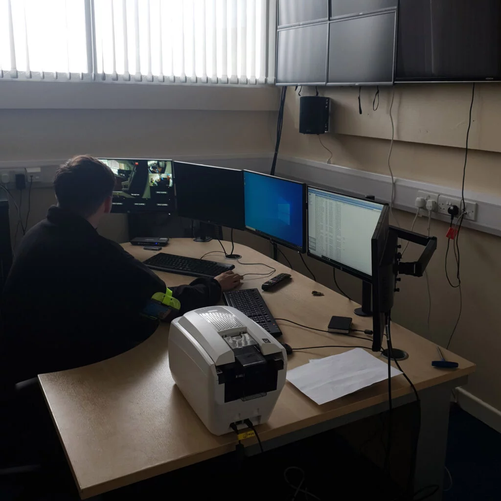 Security guard watching monitors. Cerebral Security Solutions. Security Guarding, Door Supervisors, Hotel Security, Keyholding, Mobile Security, Vacant Property Security, Farm Security, Education Security. Bristol, Somerset.